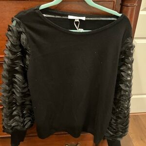New with tags black dressy top with detailed long sleeves!
